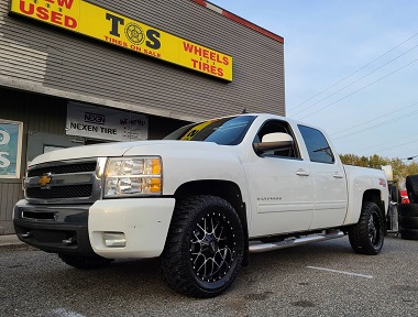 white truck with moto metal wheels installed